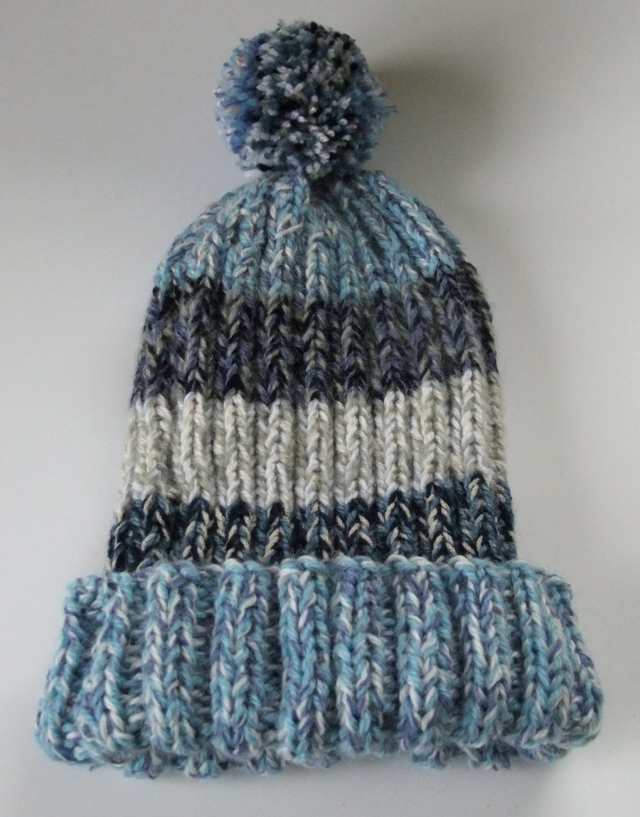 Shades of blue knitted bobble hat hand made from warm soft chunky wool.