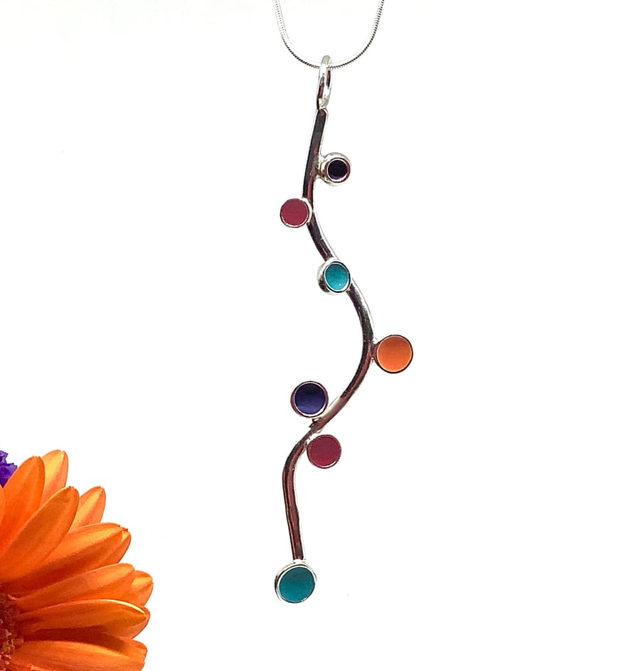 Sterling silver and enamel pendant with red, orange, purple and turquoise  