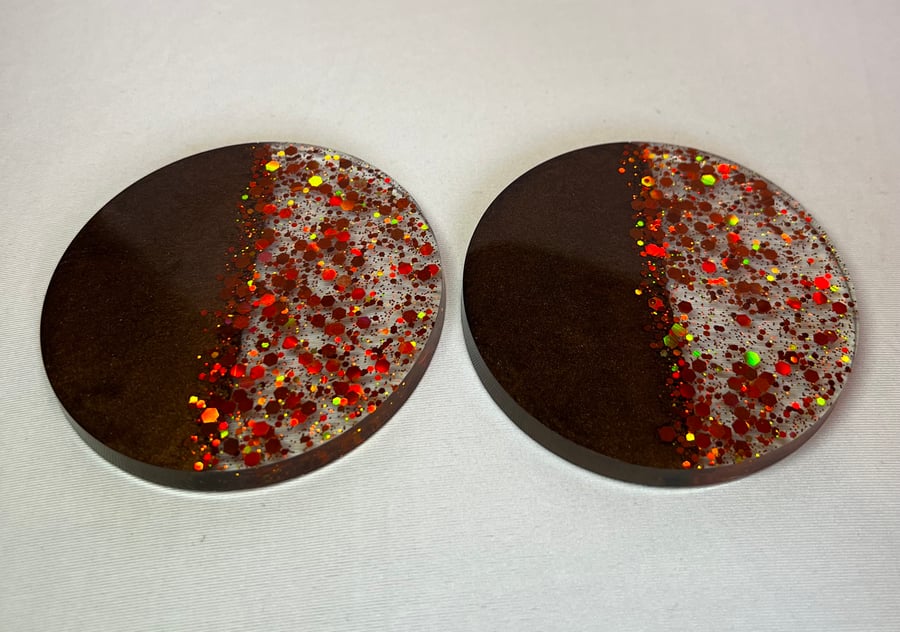 Set of 2 chocolate brown and bronze glitter resin coasters.