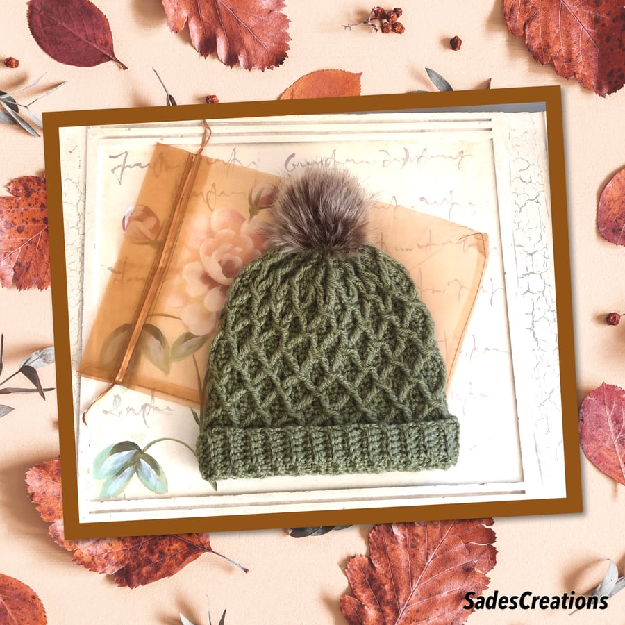 Stylish Beanie hat with faux fur Pom in olive green.