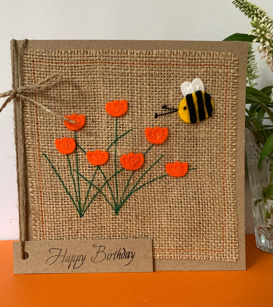 Handmade Birthday Card. Bright orange flowers with a bee from wool felt. 