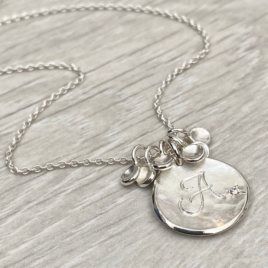 Handmade solid silver 16mm diamond petal charm pendants on a trace chain