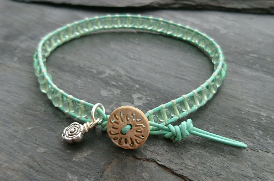 Fresh green leather and glass bead bracelet, wooden button, flower charm