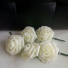 Cream rose buttonholes with pearl detail. 