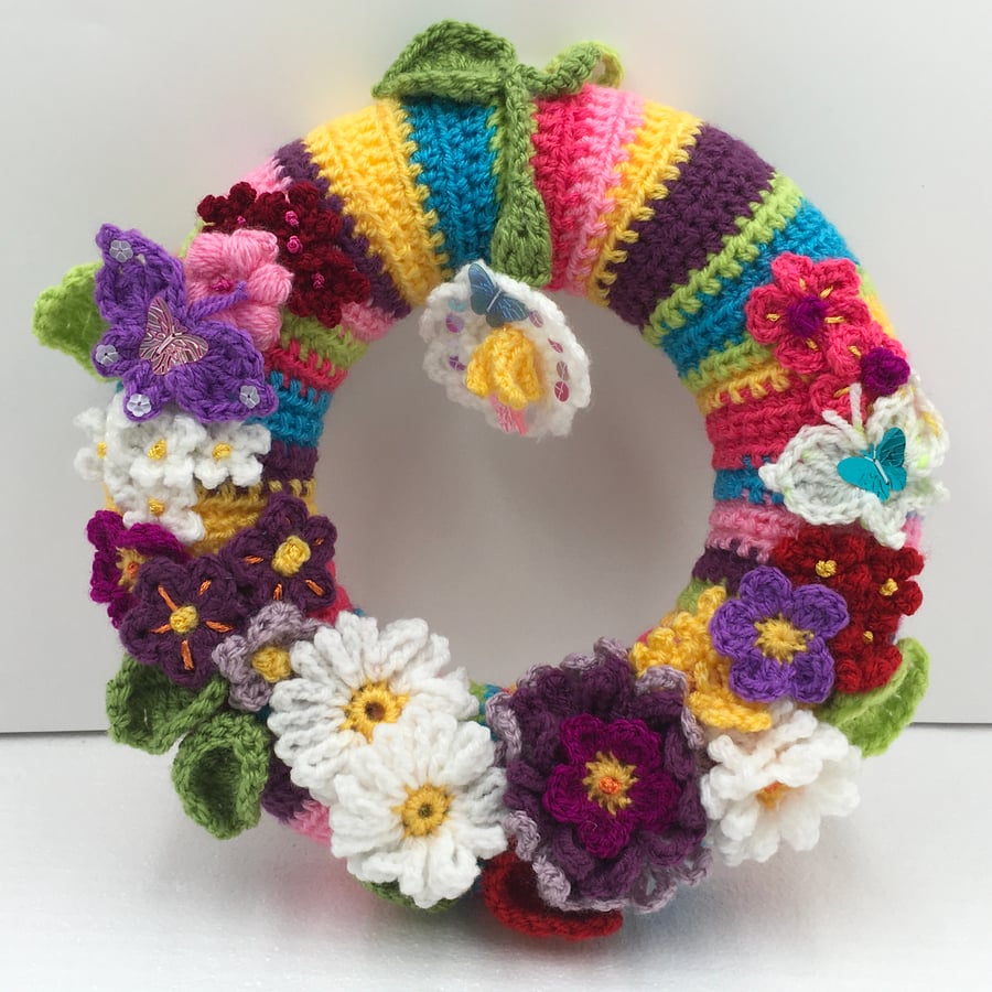 Spring into Summer with this Cheerful Wreath Full of Crocheted Pretty Flowers. 