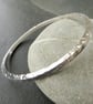 Silver modern bangle with beaten texture, Hallmarked