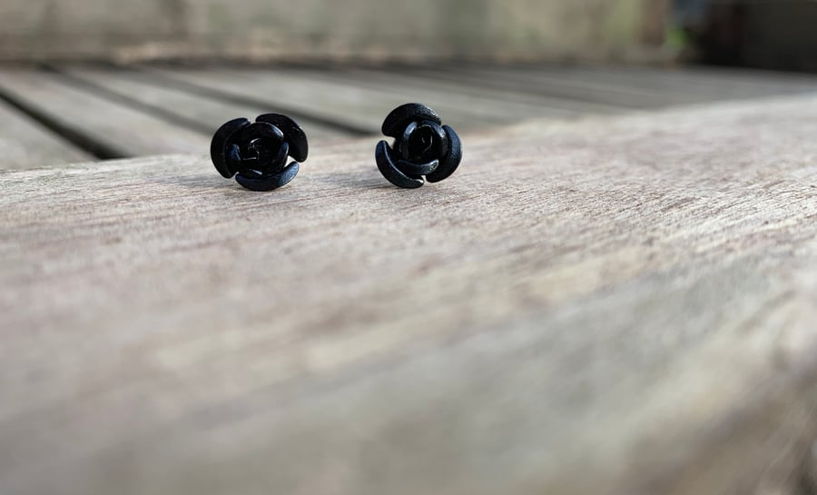 Black metal rose studs