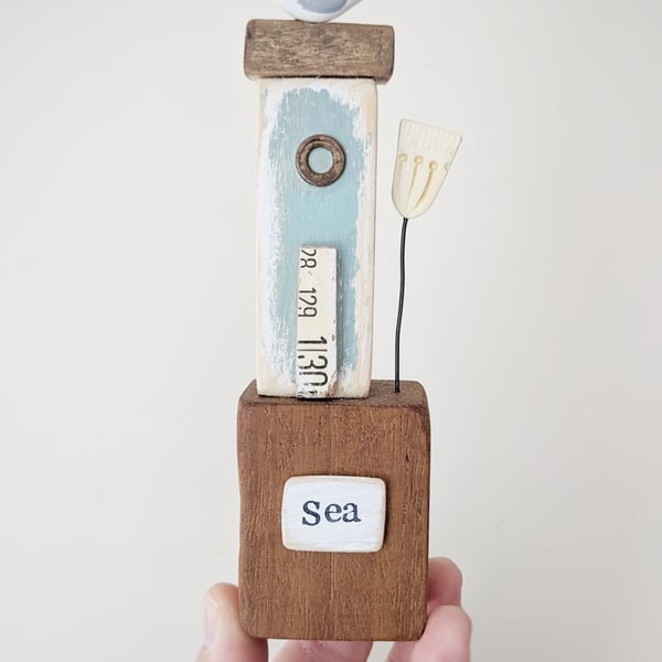 Tall Wooden Sea Hut with Clay Flower and Seagull 'Sea'