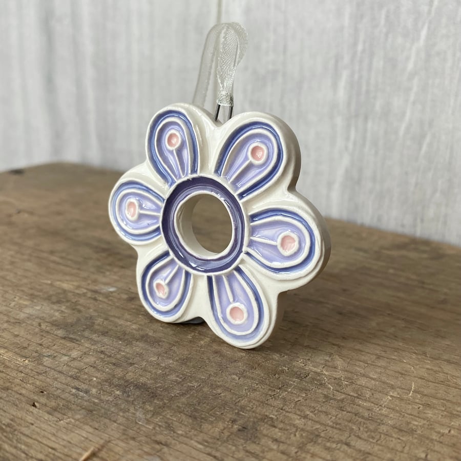 Intricate ceramic flower decoration lilac