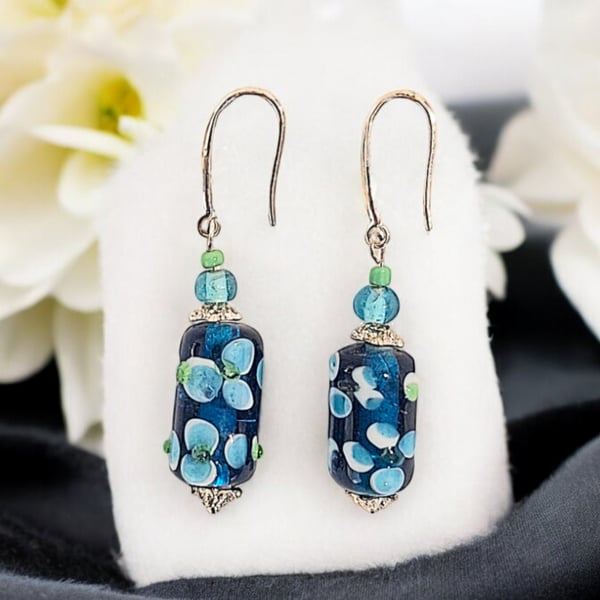 Beautiful blue floral lampwork beaded earrings, very elegant with stirring silve