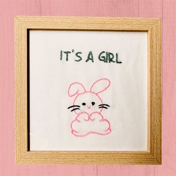 Baby girl gift, picture of a cute pink bunny rabbit and it’s a girl, embroidered
