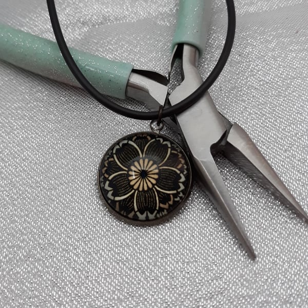 NL105 Flower picture pendant on cord necklace