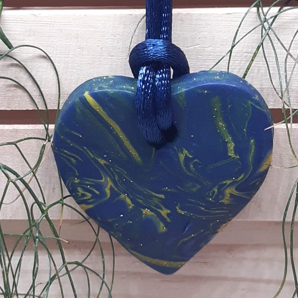 Polymer clay heart shaped pendant with a touch of sparkle