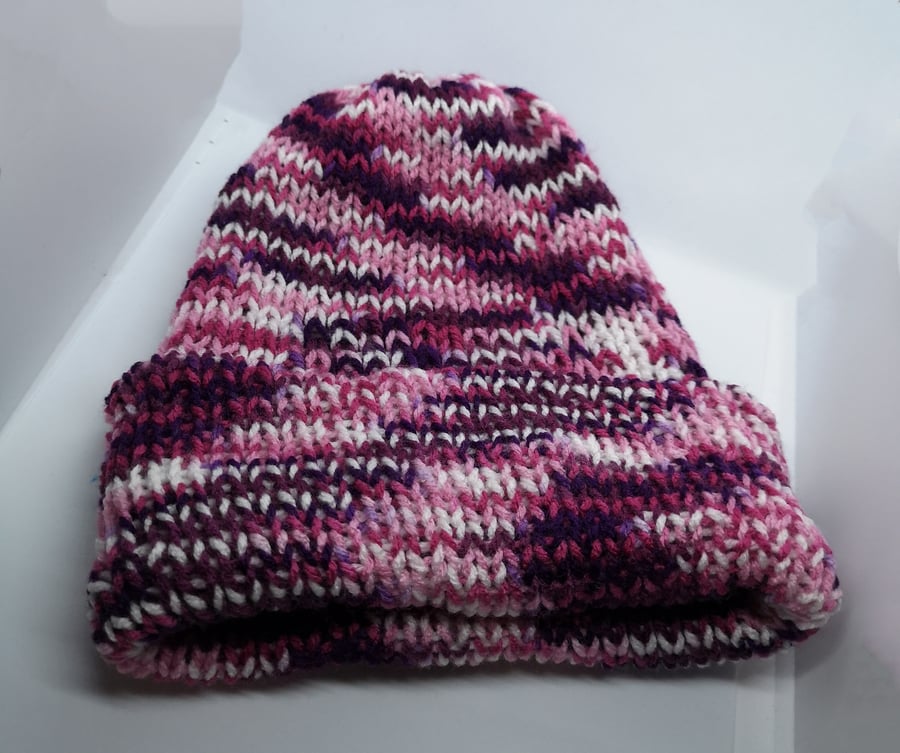 Handknitted pink, purple and white hat