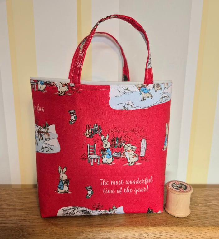 Christmas gift bag: Peter Rabbit on red