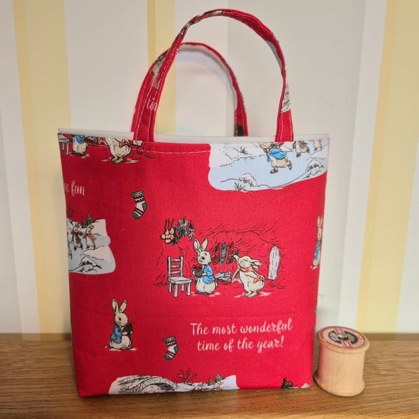 Christmas gift bag: Peter Rabbit on red