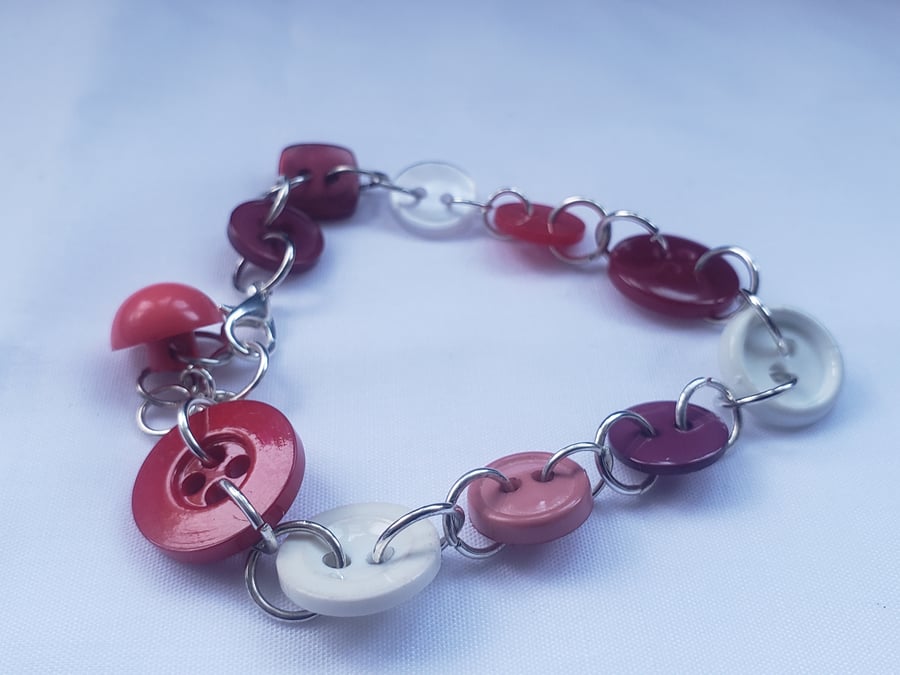 Linked red shades button bracelet