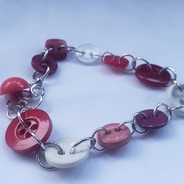 Linked red shades button bracelet