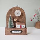 Festive Wooden Cottage Scene with Star and Moon