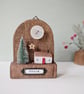 Festive Wooden Cottage Scene with Star and Moon