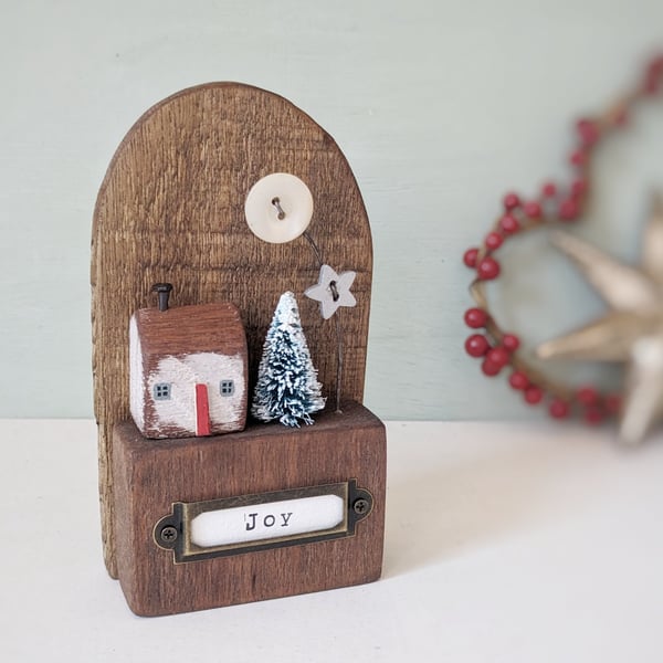 Festive Wooden Cottage Scene with Star and Moon