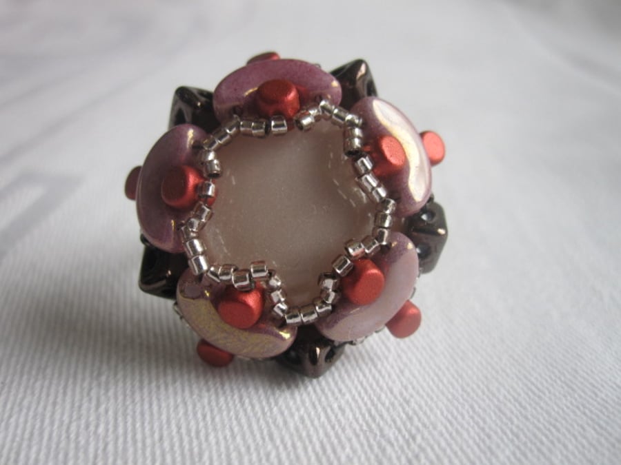 A Brown, Red and Purple Beadwork Ring
