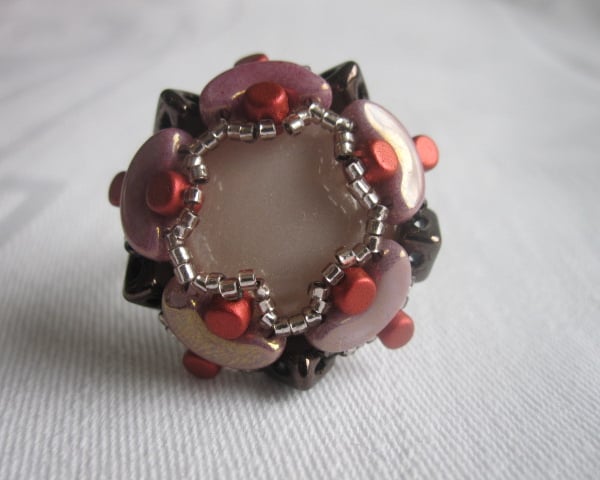 A Brown, Red and Purple Beadwork Ring