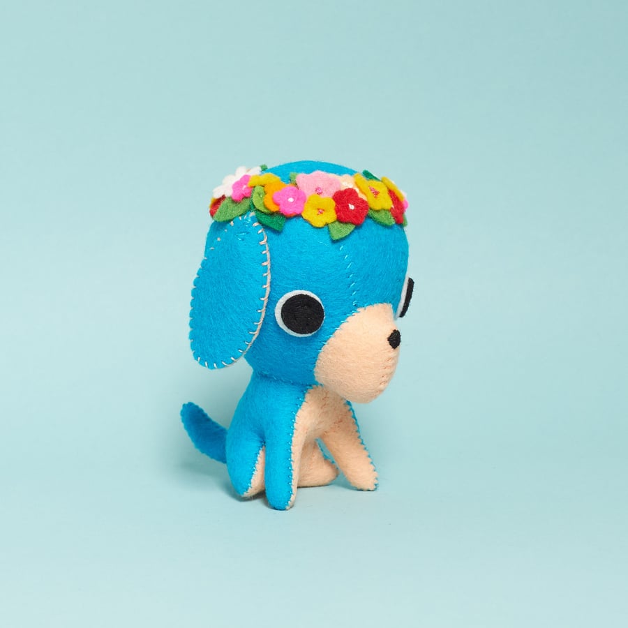 Blue felt dog ornament with a bright flower crown