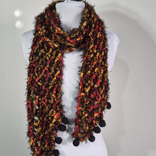 Long Thin Handknitted Scarf in Black Orange And Red With Hand Felted Baubles .