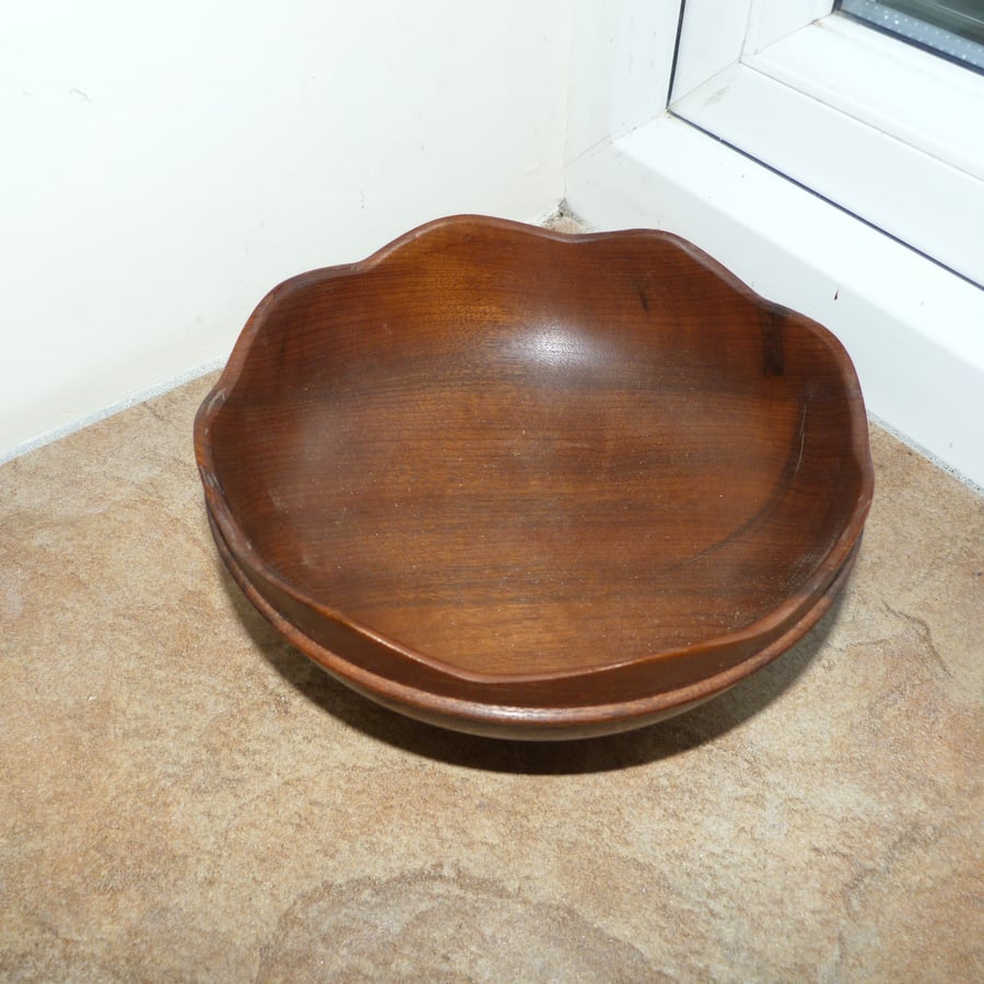 Walnut side bowl, with hand carved top edge, 6  " in diameter