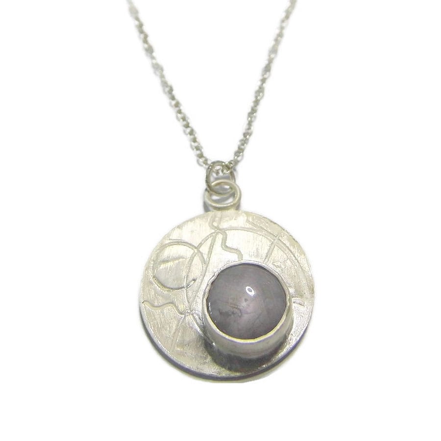 sterling silver disc with star sapphire