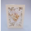 Wedding card with large white and gold textured heart.