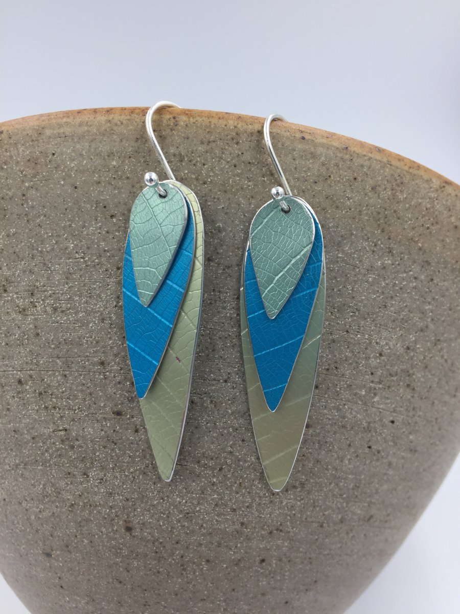 Anodised aluminium 3 layer parrot wing earrings in pale green, teal and turquois