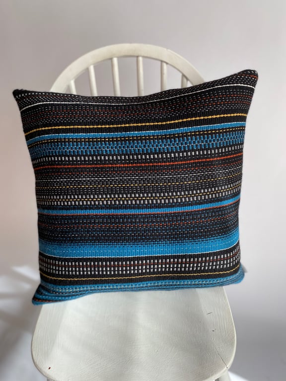 Magic City 2: Hand woven wool cushion, designed and made by Yvonne Skelton