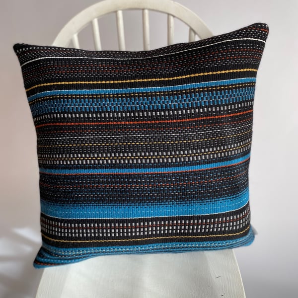 Magic City 2: Hand woven wool cushion, designed and made by Yvonne Skelton