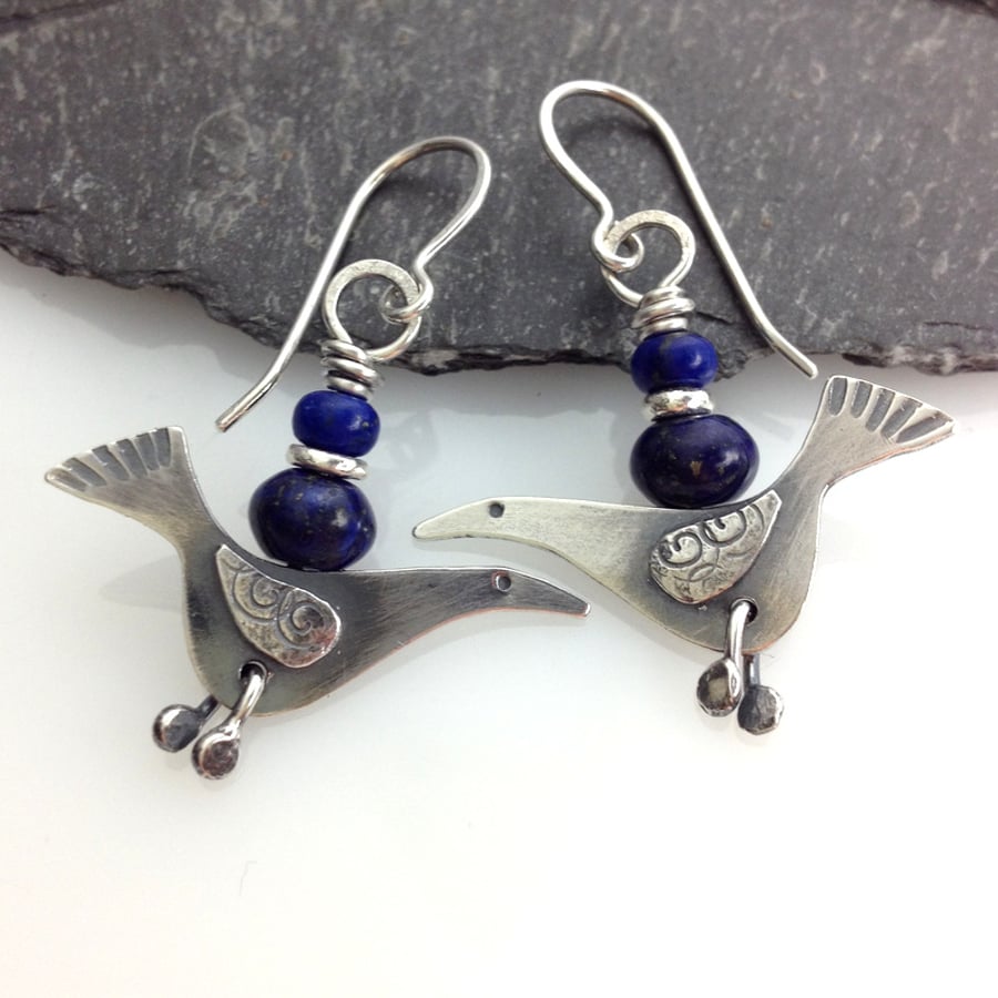 silver bird earrings with lapis lazuli.