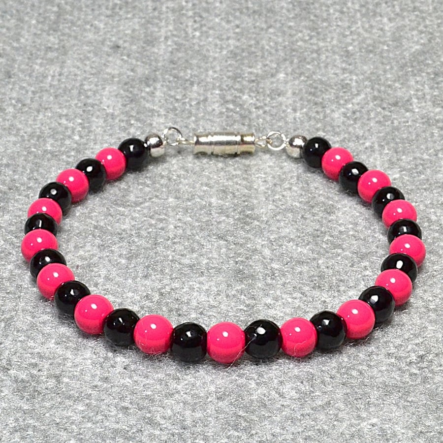 Opaque Pink and Faceted Black Glass Bead Bracelet