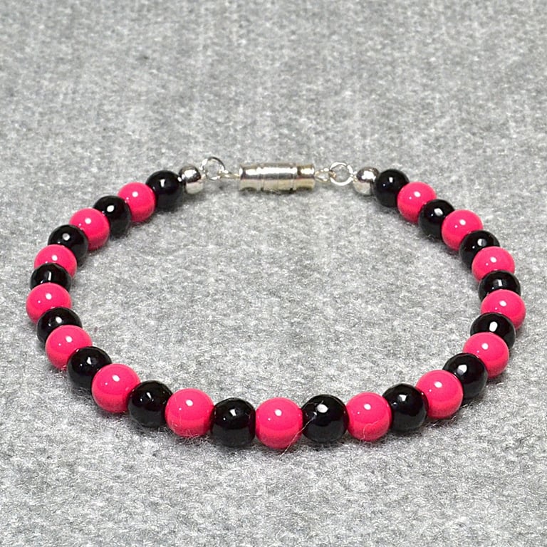 Opaque Pink and Faceted Black Glass Bead Bracelet