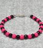 Opaque Pink and Faceted Black Glass Bead Bracelet