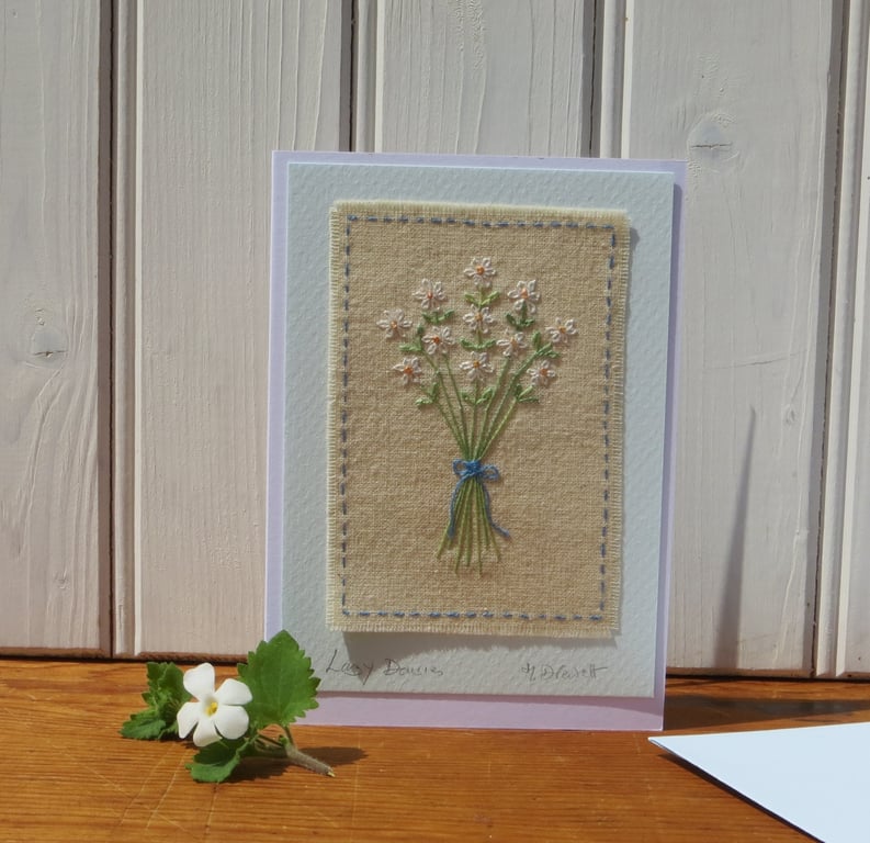 Lazy Daisies hand embroidered card with finely worked daisies and bow