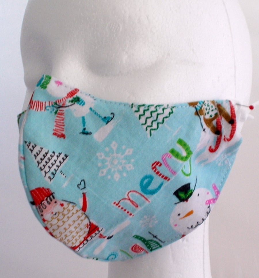 Hand made small face mask printed with fun festive cartoon characters