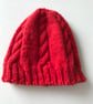 Red beanie hat with cabled panels - Image 1