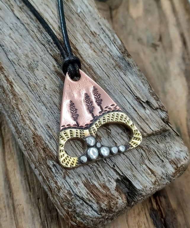 Copper, brass and silver 'abstract' landscape pendant 