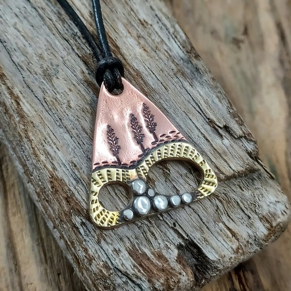 Copper, brass and silver 'abstract' landscape pendant 