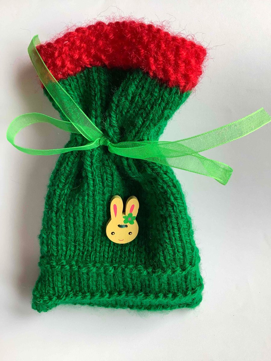 An original knitted gift bag with rabbit button 