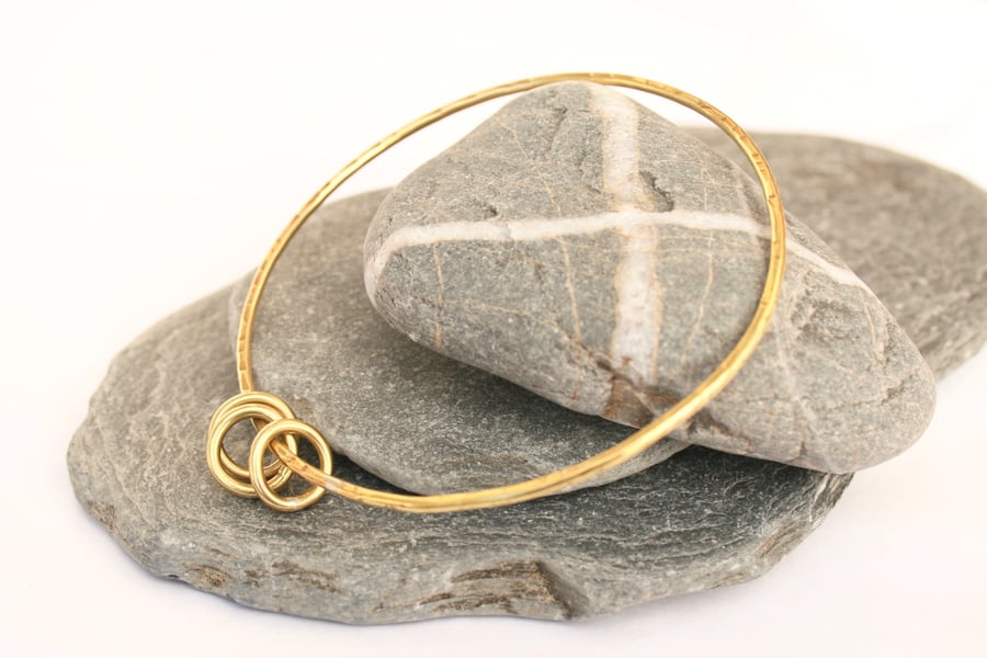 Brass bangle with hoops