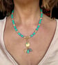 Gorgeous boho turquoise and gold charm necklace