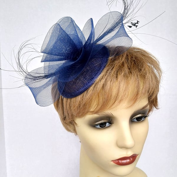 Navy blue fascinator with 'crin' ruffle and feathers 