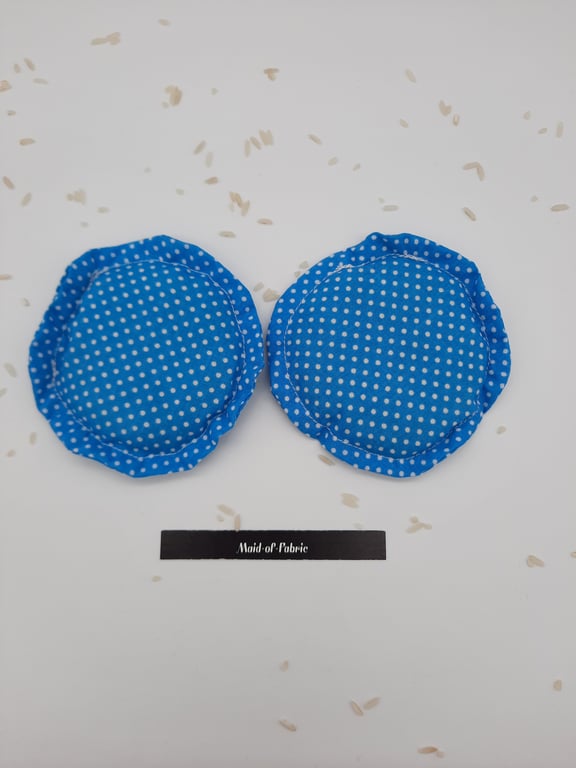 Heat pads, hand warmers, rice filled in blue polkadot fabric.  