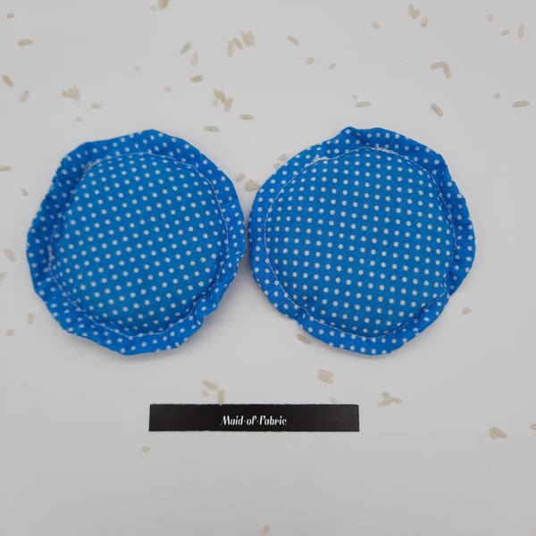 Heat pads, hand warmers, rice filled in blue polkadot fabric.  